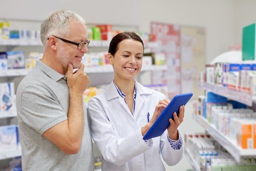 The doctor prescribes medicine against parasites to a man